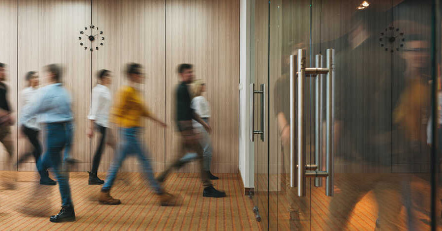 people walking in office building